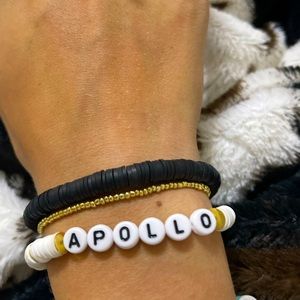 These are clay bracelets with name and gold beads mixed in